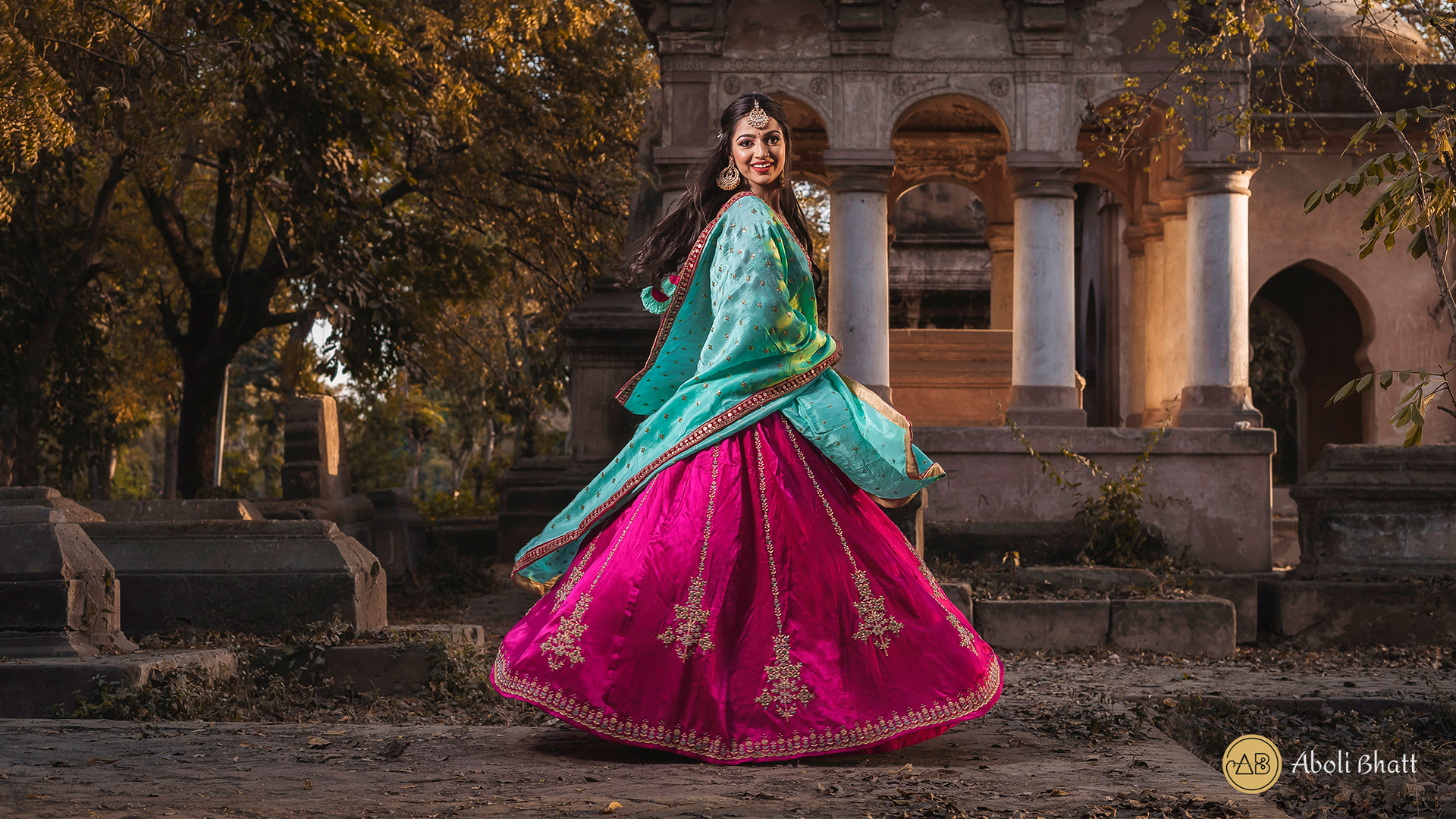 Young Indian female model in Ghagra Choli and long hair looking at camera.  Hand in welcome pose Stock Photo - Alamy